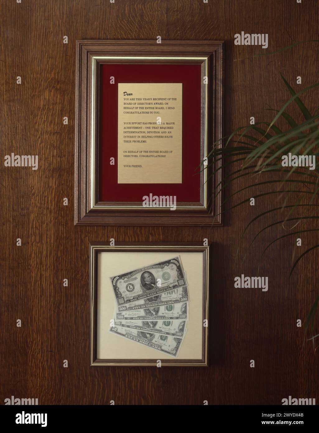 Company framed award with money Stock Photo