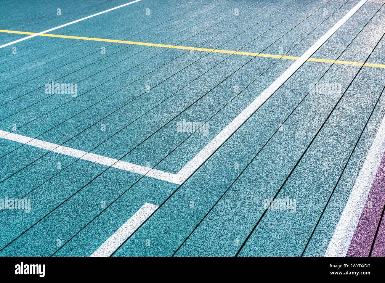 Elevated Platform Tennis, Paddle Ball courts with yellow pickelball lines.  Floor surface is green with white and yellow Stock Photo