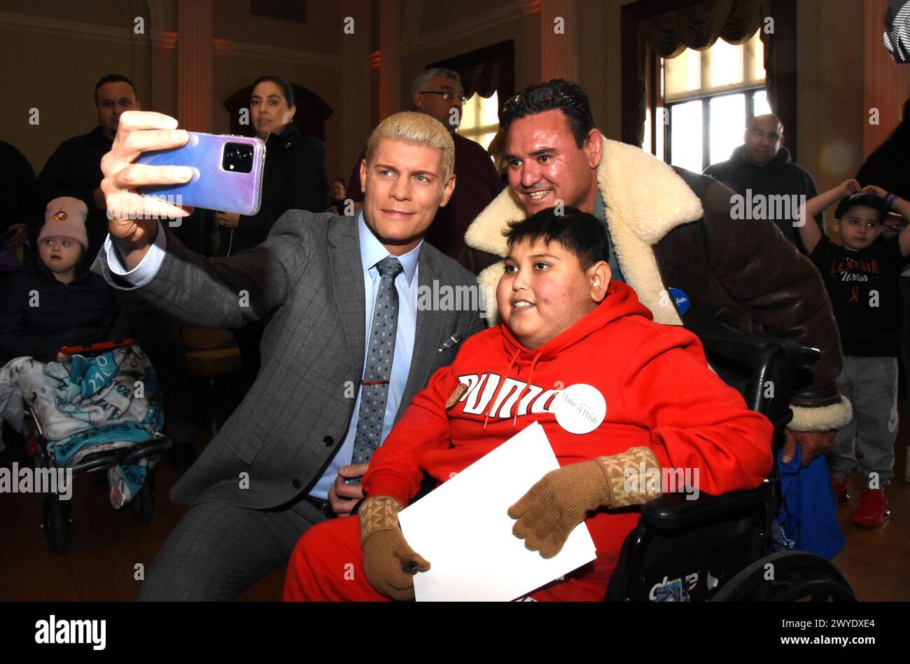 April 5, 2024, Philadelphia, Pa, USA: Cody Rhodes poses with Make-A-Wish kid at the Make-A-Wish Foundation grants wishes for 19 kids to meet WWE stars ahead of WrestleMania in Philadelphia WWE and Make-A-Wish Foundation to provide 'Circle of Champions' Event at Philadelphia Visitor Center in Philadelphia, PA. (Credit Image: © Photo Image Press via ZUMA Press Wire) EDITORIAL USAGE ONLY! Not for Commercial USAGE! Stock Photo