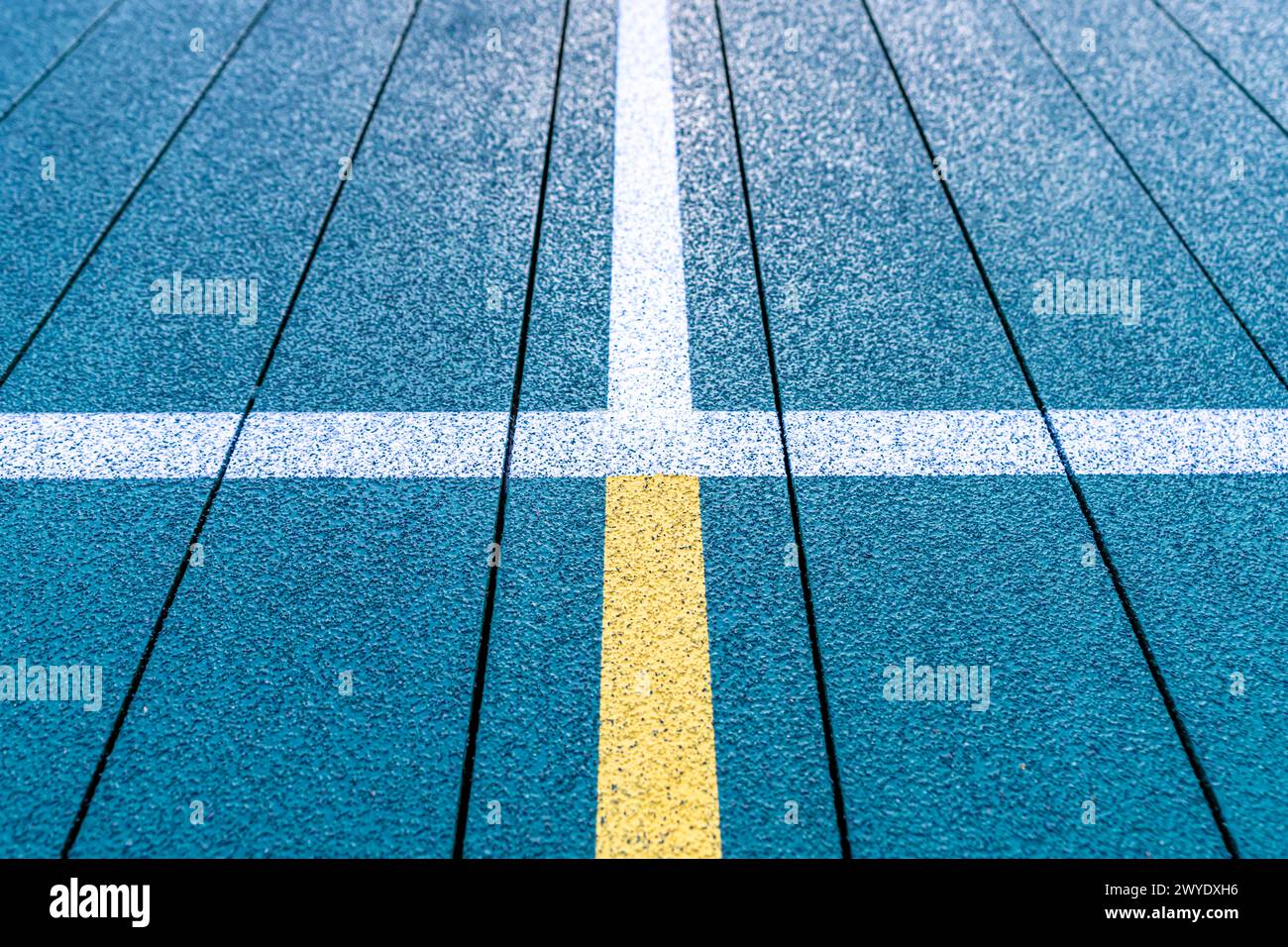 Elevated Platform Tennis, Paddle Ball courts with yellow pickelball lines.  Floor surface is green with white and yellow Stock Photo