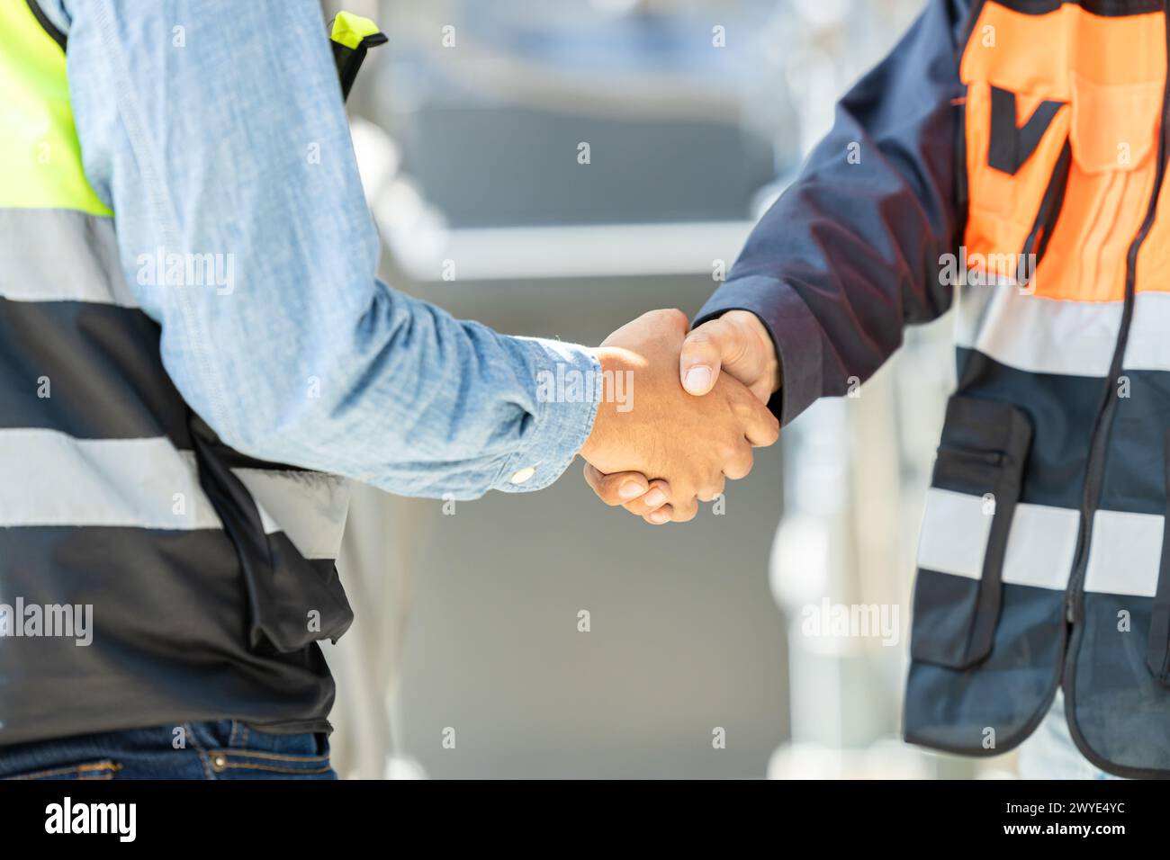 Engineer team dealing shaking hand together. Engineering cooperation group worker with construction manager teamwork working project successful. Stock Photo
