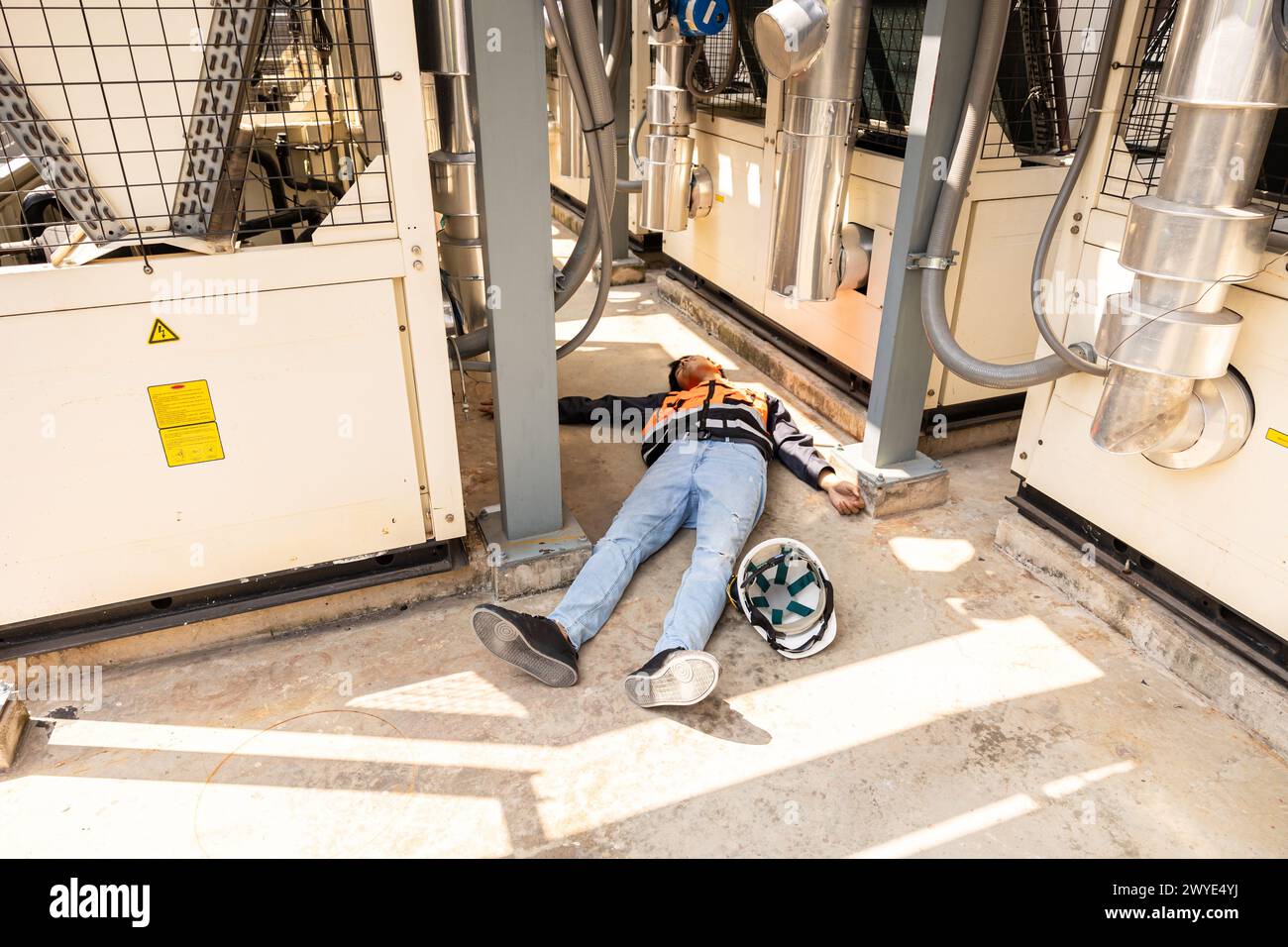 Engineer accident at work site. worker injury from electricity shock or hot weather heat stroke. Stock Photo
