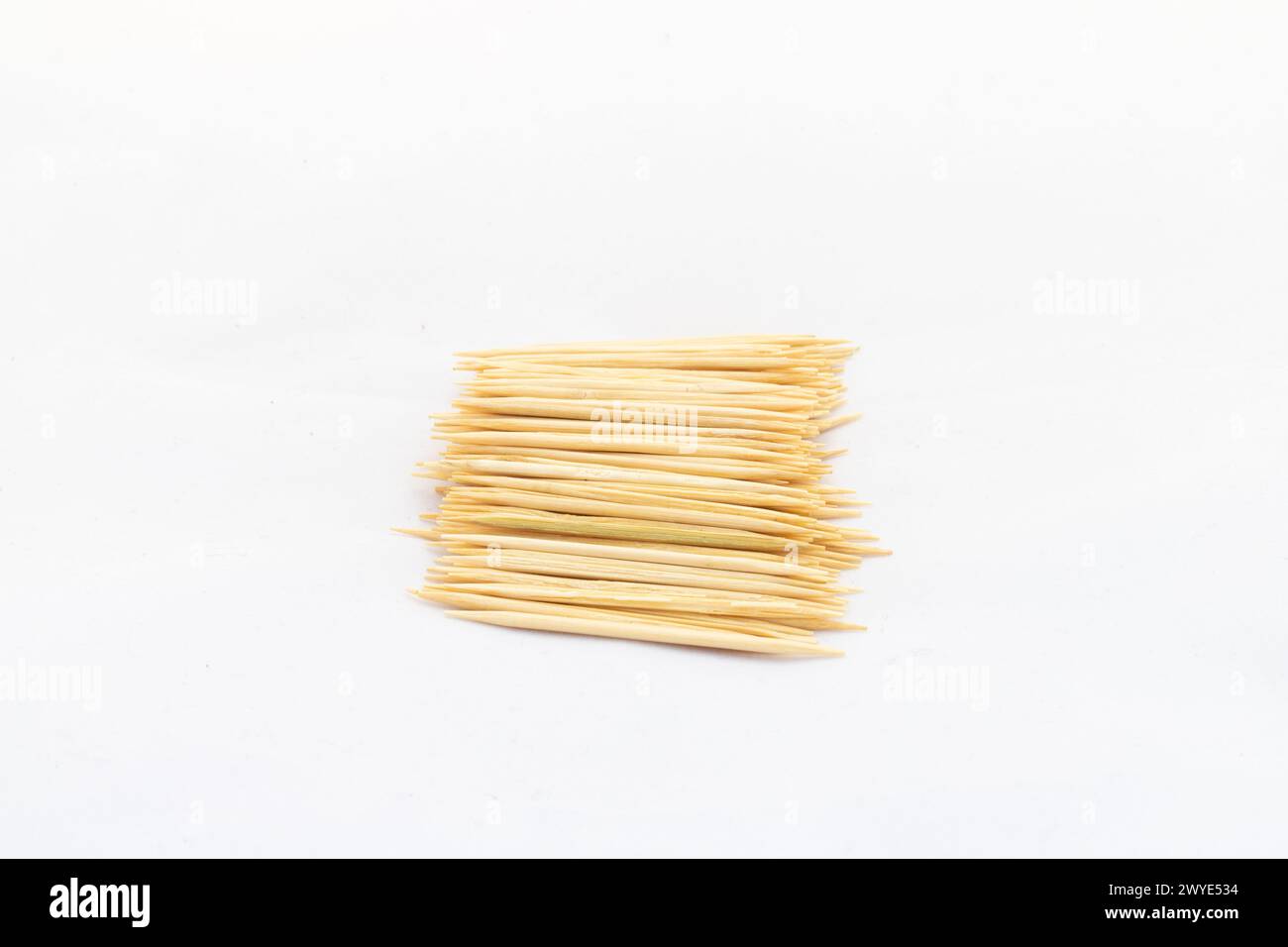 Bamboo toothpicks on white isolated background Stock Photo
