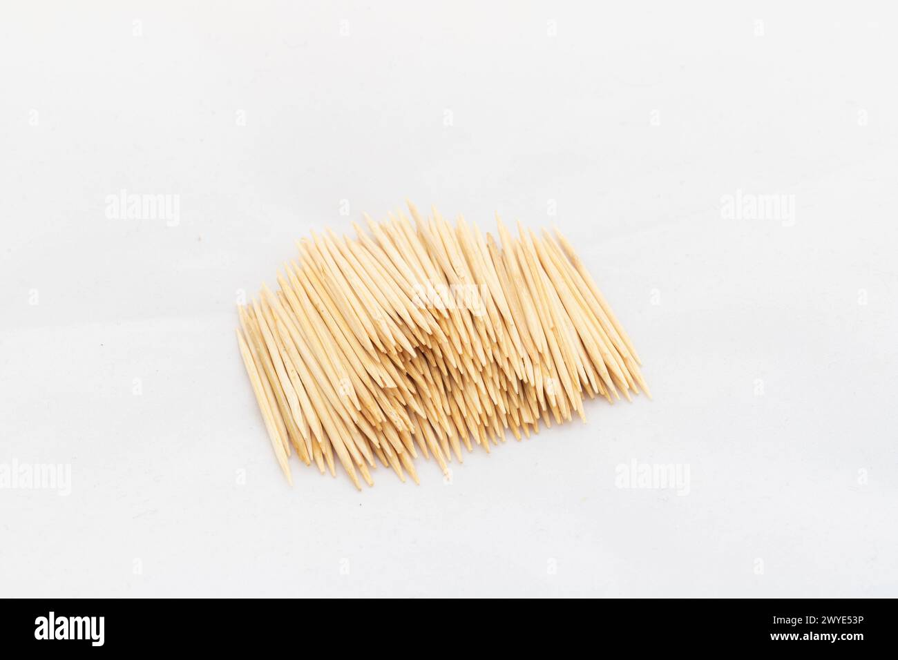 Sharp thin pointed ends toothpicks on white isolated background Stock Photo