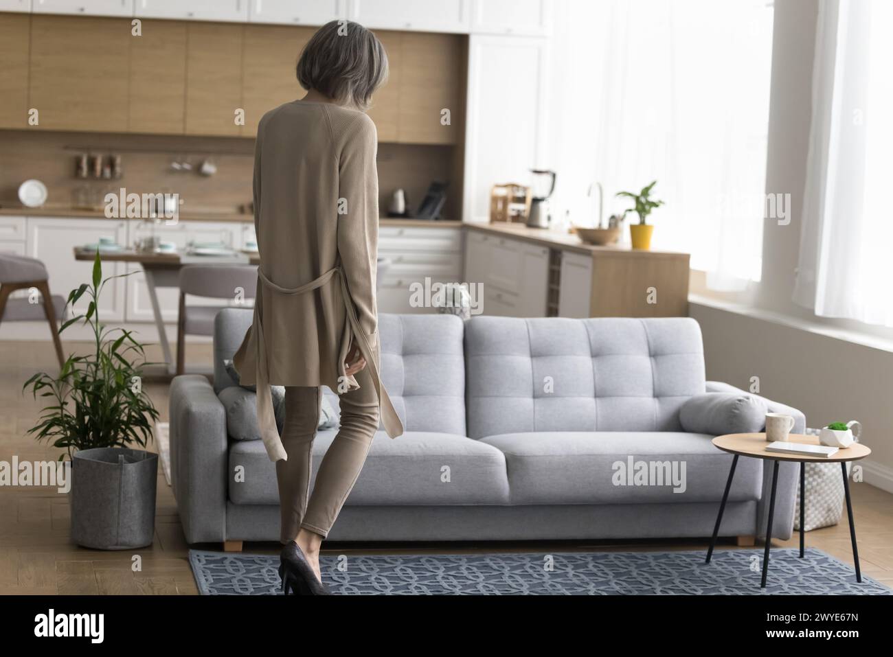 Tired mature woman back view hi-res stock photography and images - Alamy