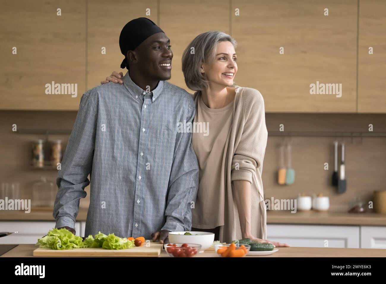 Middle aged multiethnic cooking hi-res stock photography and images - Alamy