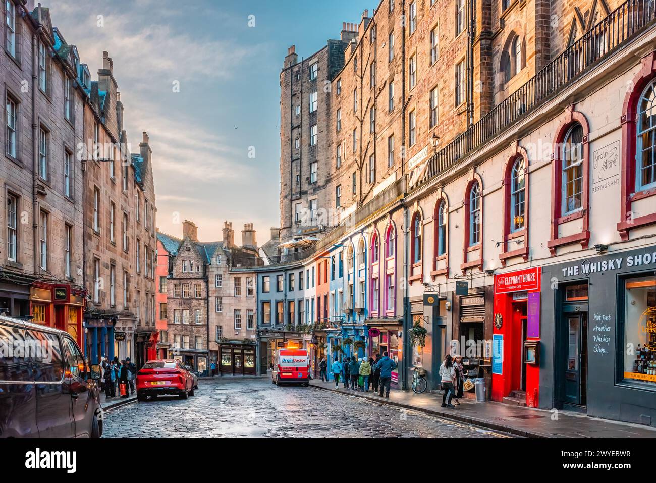 Edinburgh, Scotland - January 22nd, 2024: colorful painted storefronts and old buildings along the famous Victoria Street in Edinburgh Old Town Stock Photo