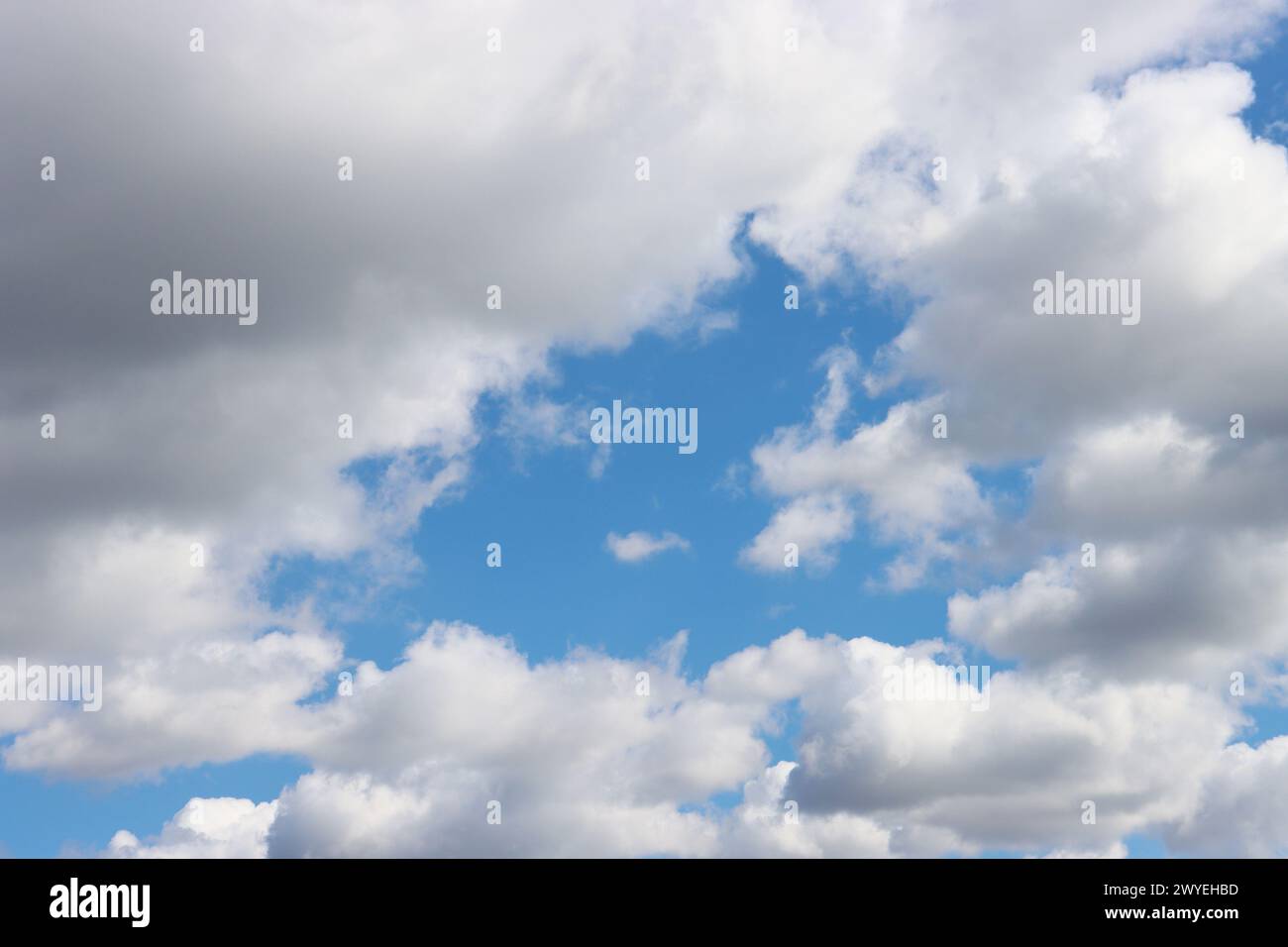 Cloud clusters scattered in blue sky With copyspace for text. Stock Photo
