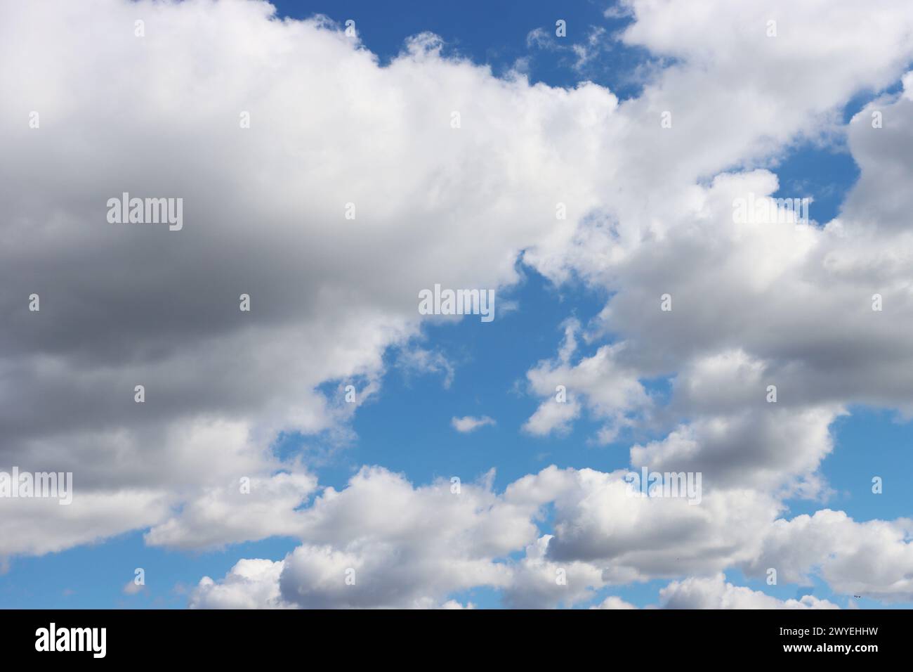 Cloud clusters scattered in blue sky With copyspace for text. Stock Photo