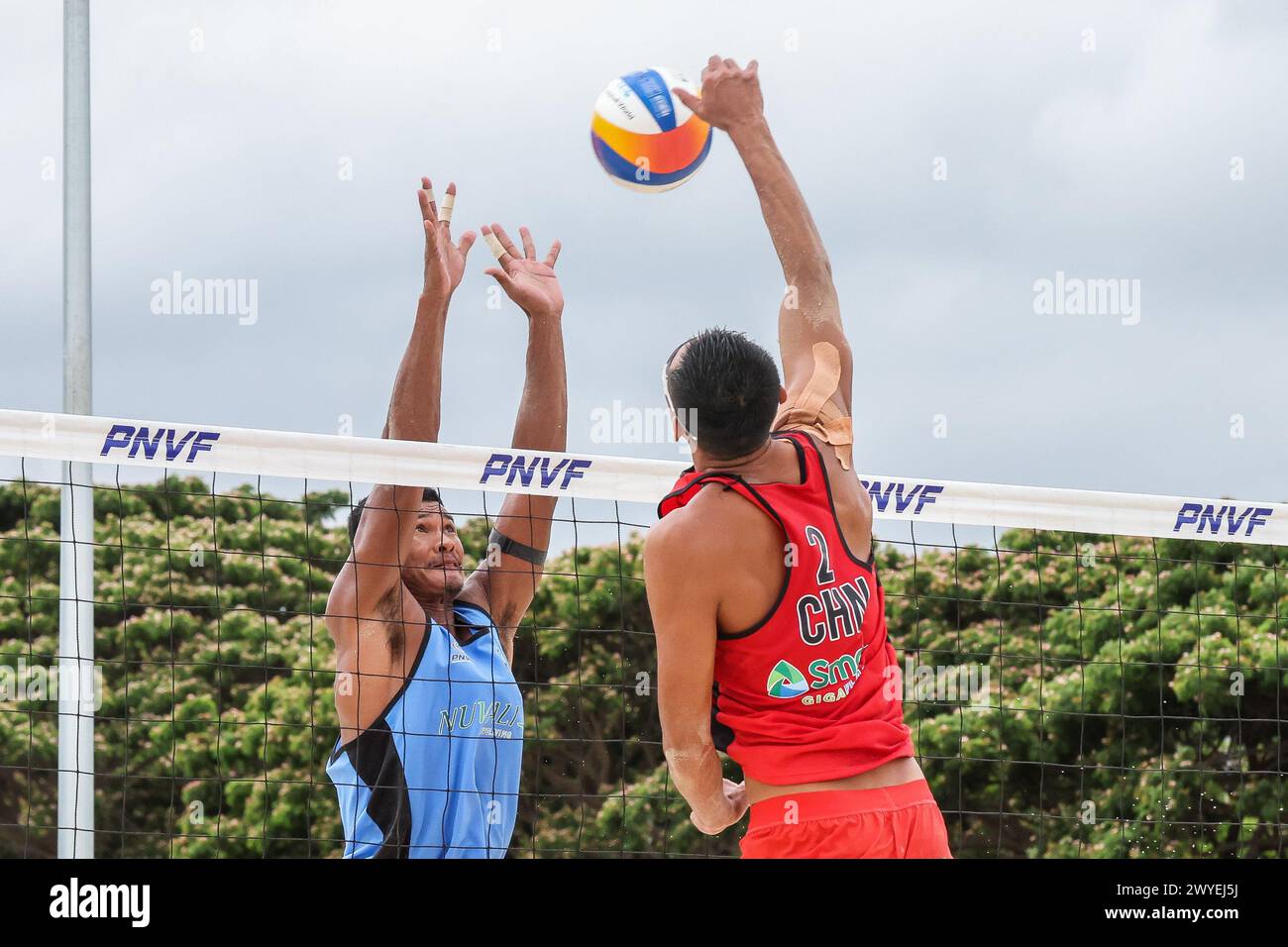 Laguna Province, Philippines. 6th Apr, 2024. Liu Chuanyong (R) of China competes against Dunwinit Kaewsai of Thailand during the men's round of 16 match between Liu Chuanyong/Li Zhuoxin of China and Dunwinit Kaewsai/Suring Jongklang of Thailand at the Asian Volleyball Confederation (AVC) Beach Tour Nuvali Open in Laguna Province, the Philippines, April 6, 2024. Credit: Rouelle Umali/Xinhua/Alamy Live News Stock Photo