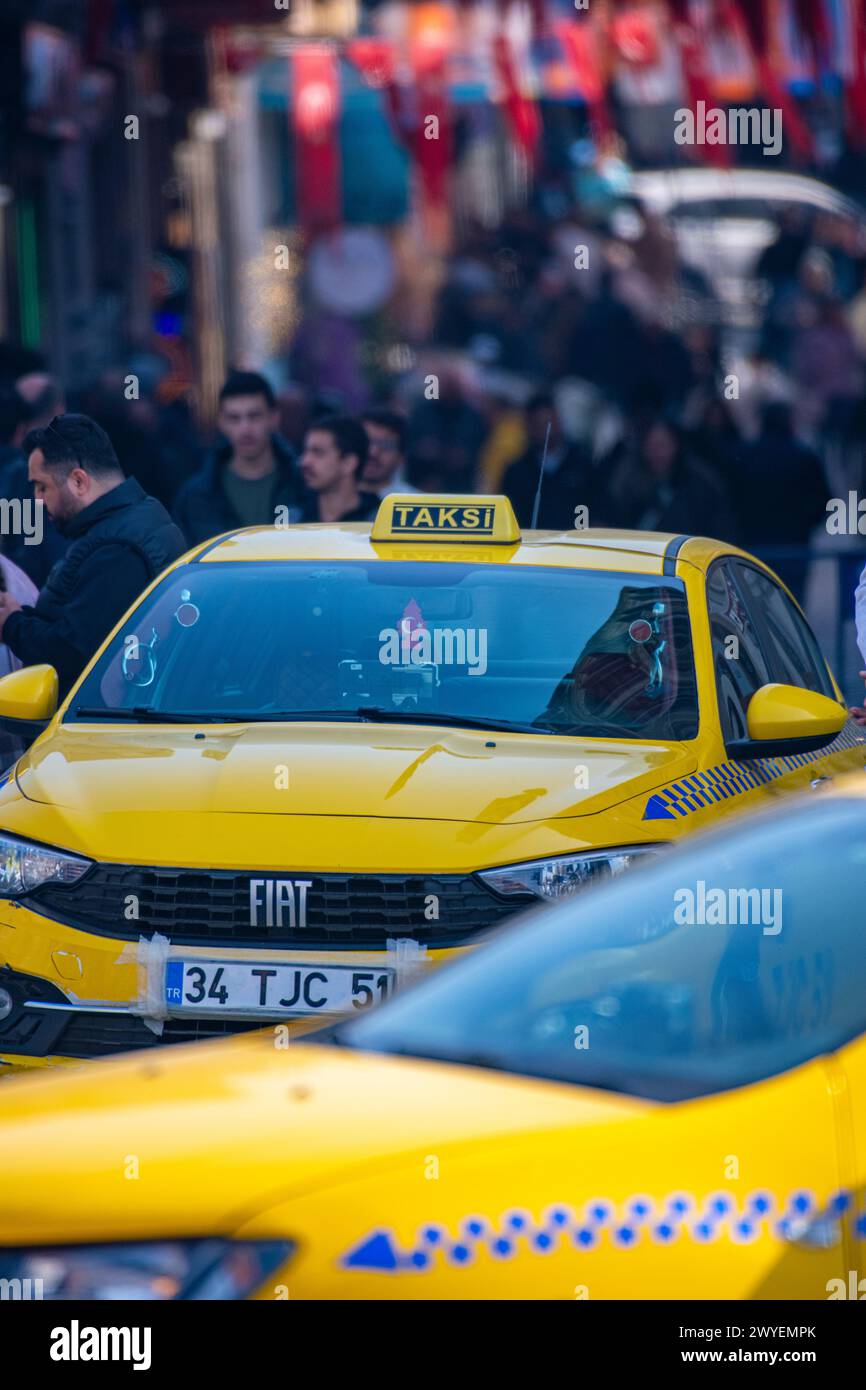 Taxis stuck in busty traffic amongst the crowds in central Istanbul Stock Photo