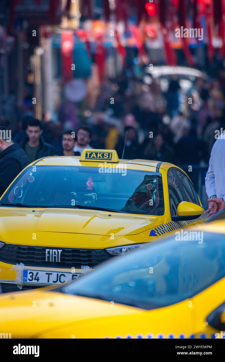 Taxis stuck in busty traffic amongst the crowds in central Istanbul Stock Photo