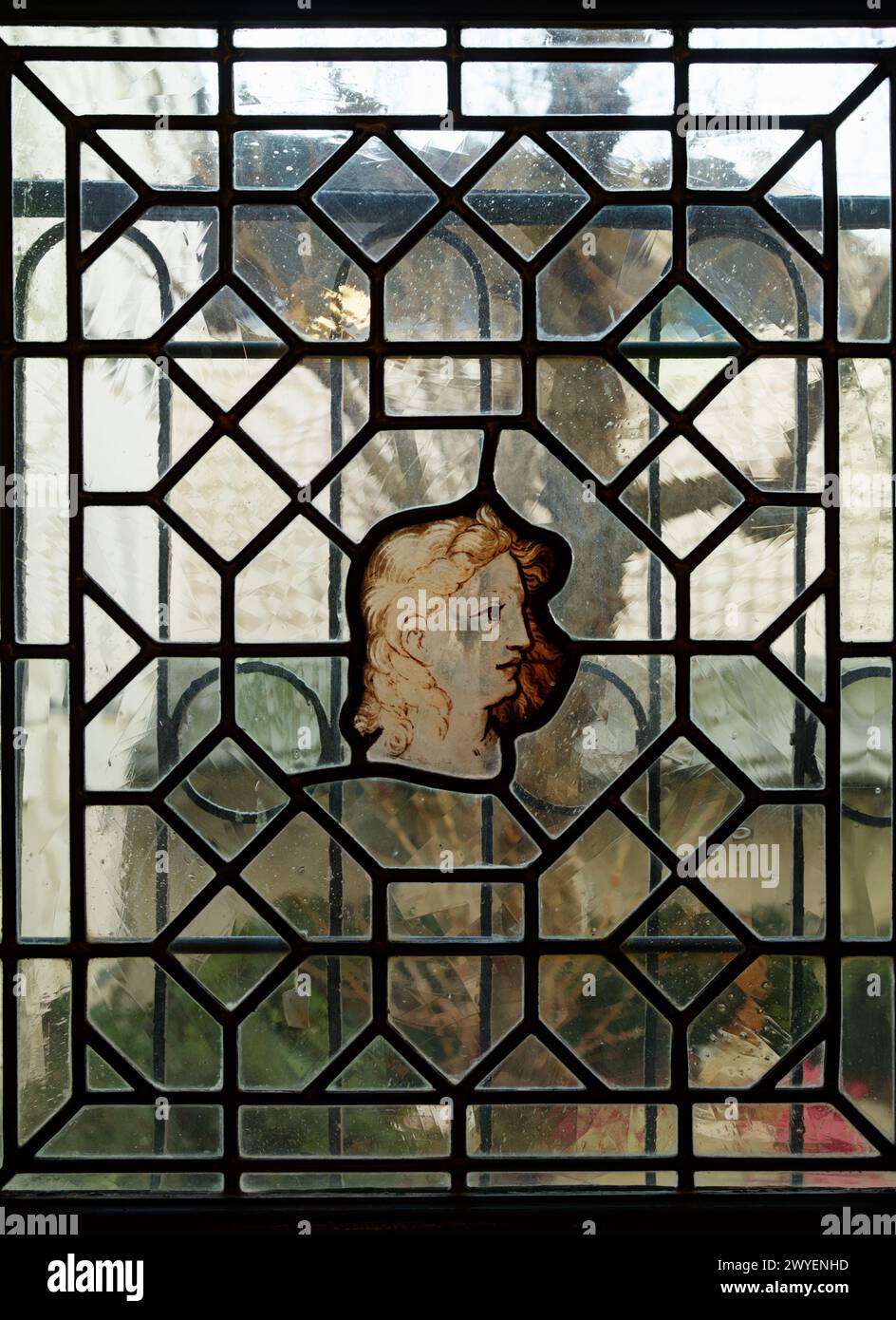 Detail Of A Stained Glass Window Of The Head Of A Woman On The Staircase Of Maison Victor Hugo, Place Des Vosges, Paris,France Stock Photo
