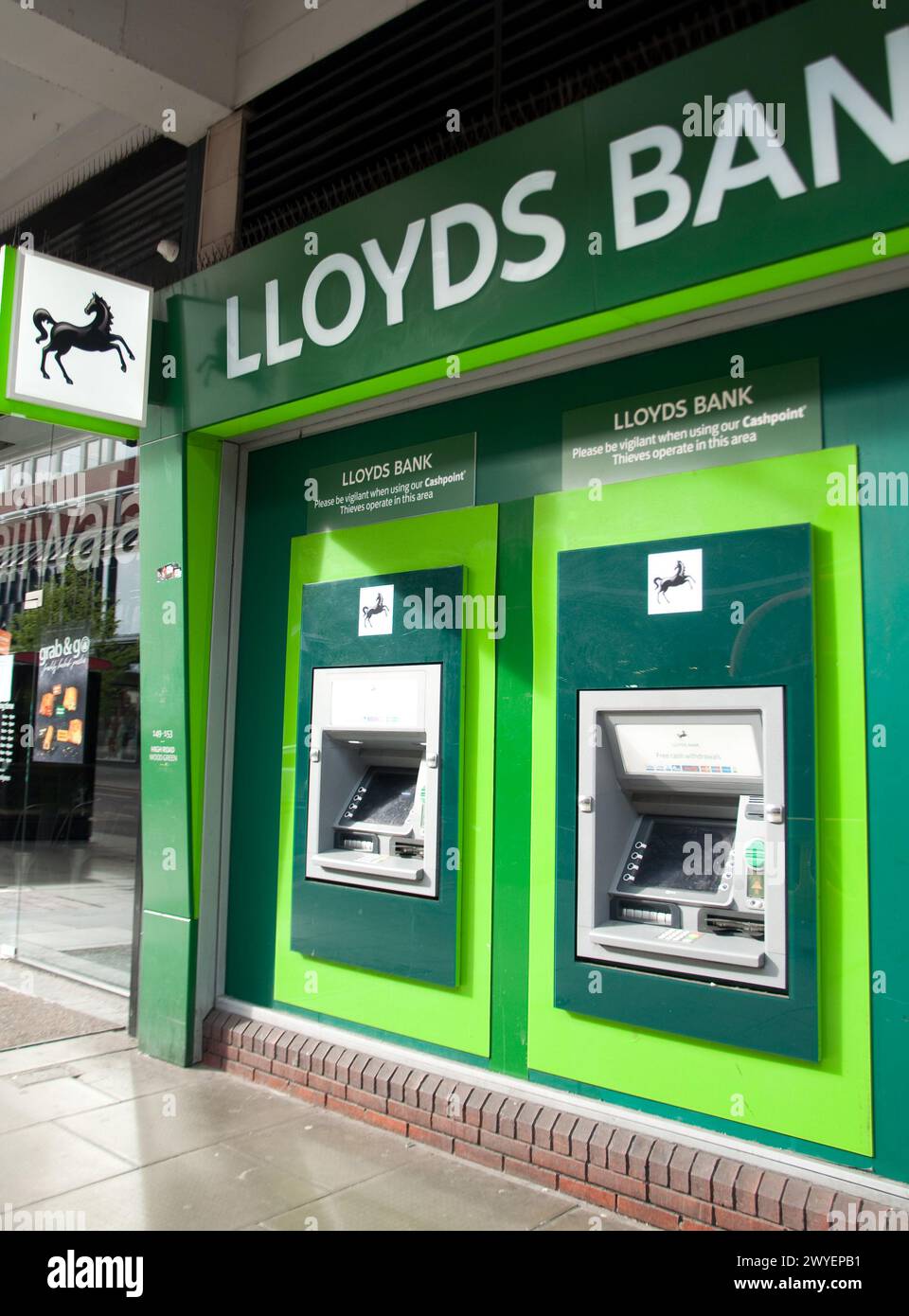 Lloyds Bank, Cheapside, Wood Green High Street,  Wood Green, London Borough of Haringey, Greater London, England, United Kingdom; Cash machines; ATMs; Stock Photo