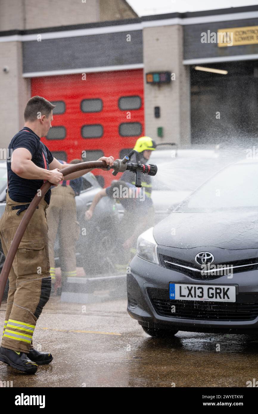 Brentwood Essex 6th April 2024 Essex Firefighters carry out a charity car wash at Brentwood Fire Station The event was in aid of the Fire Fighters charity. Credit: Ian Davidson/Alamy Live News Stock Photo