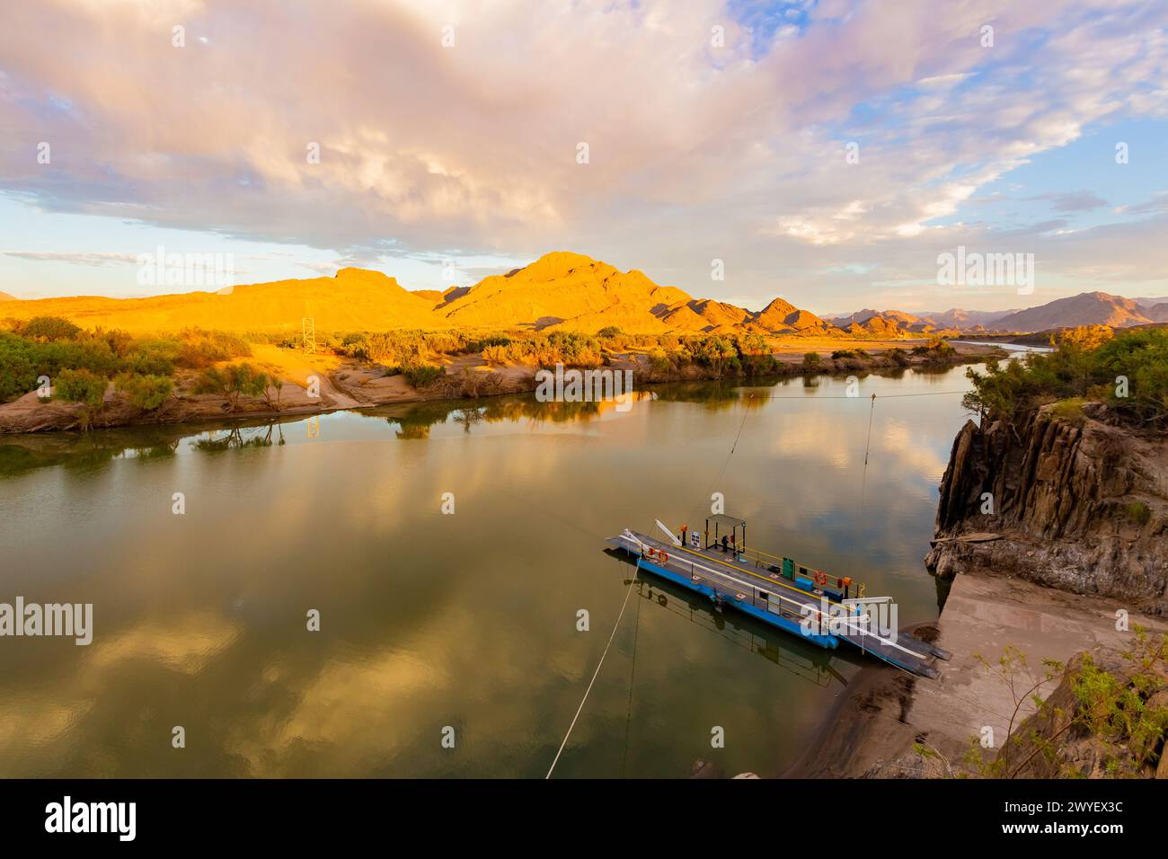 Richtersveld, South Africa - March 12, 2024: Pontoon ferry boat river crossing on the Orange River at Senderlingsdrif Stock Photo