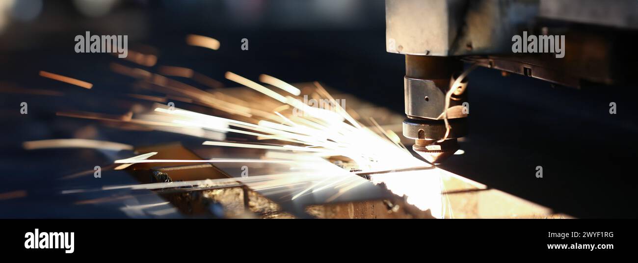 Sparks fly out machine head for metal processing Stock Photo