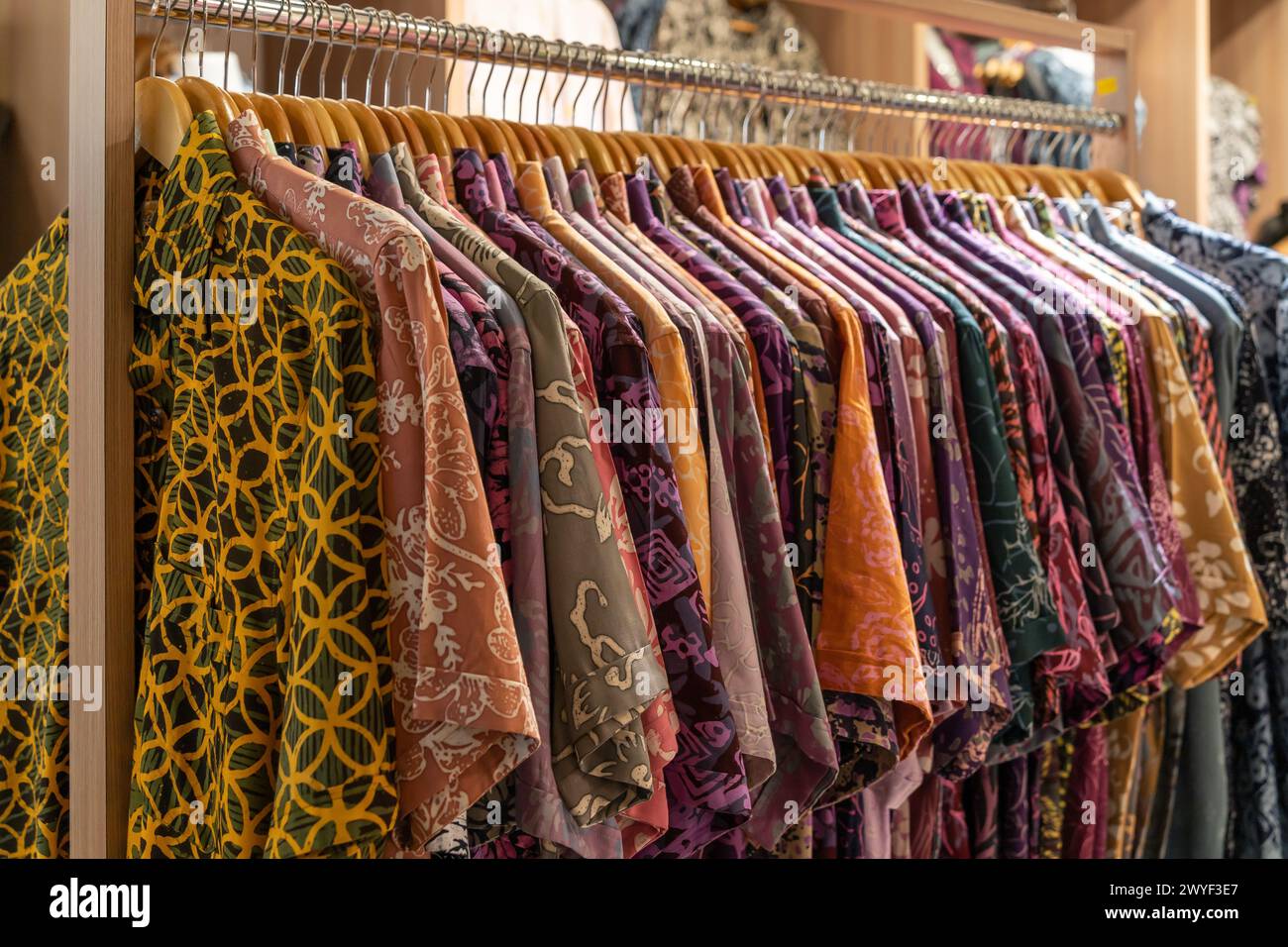 Various types of batik shirts for sale in the retail shop. Stock Photo