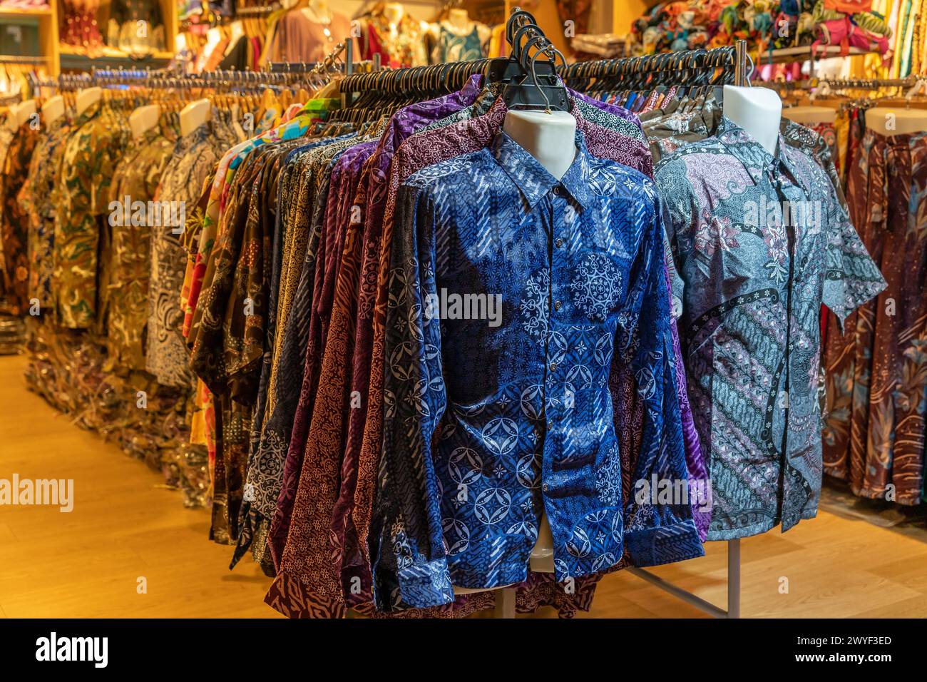 Various types of batik shirts for sale in the retail shop. Stock Photo
