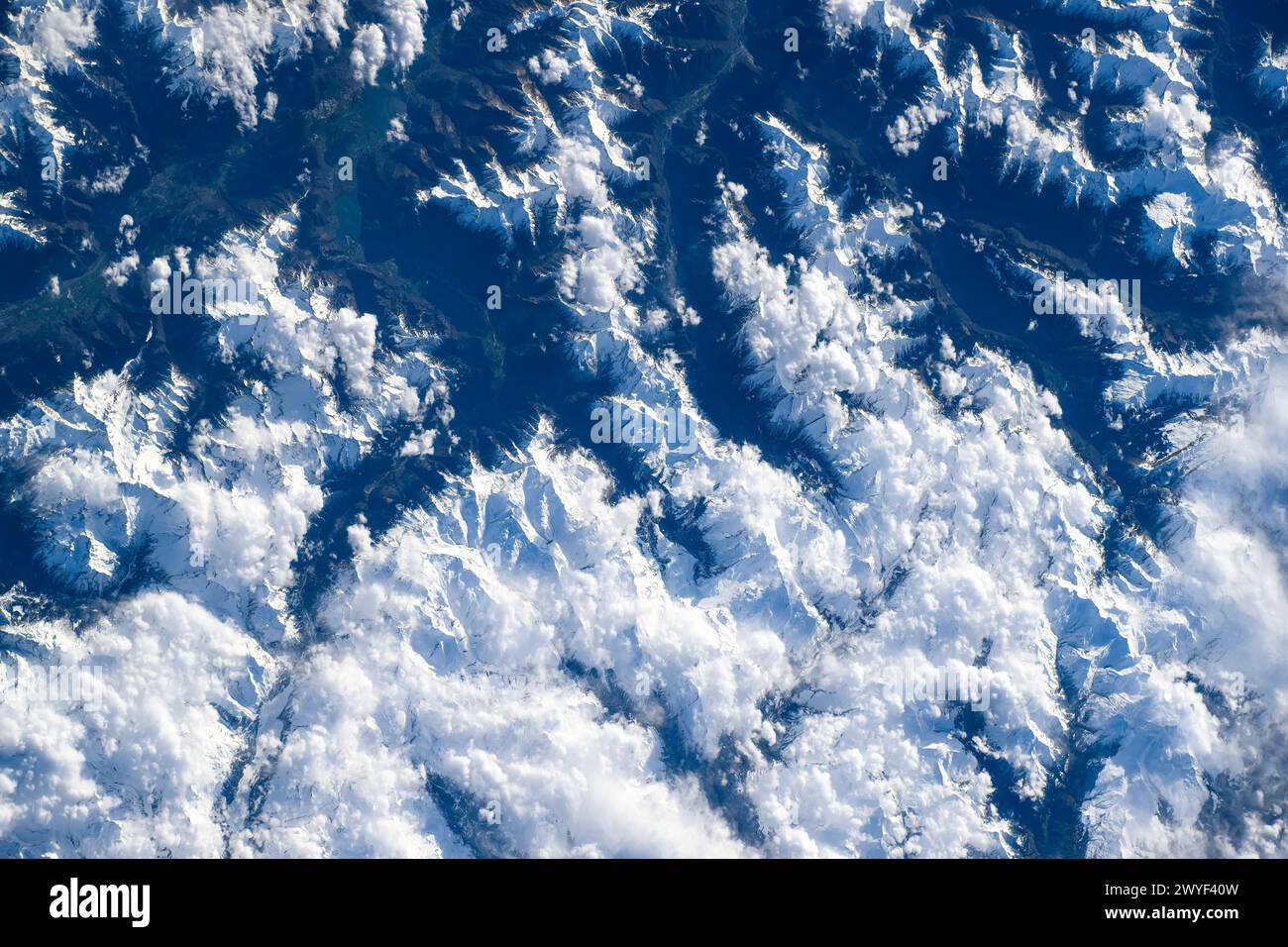 Mountain range covered in snow, Austria. Digital enhancement of an image furnished by NASA Stock Photo