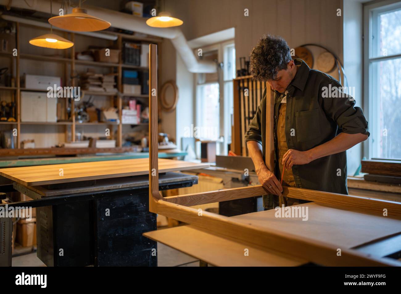 Carpentry workshop, focused craftsman master working. Joinery, woodwork. Small business. DIY. Stock Photo