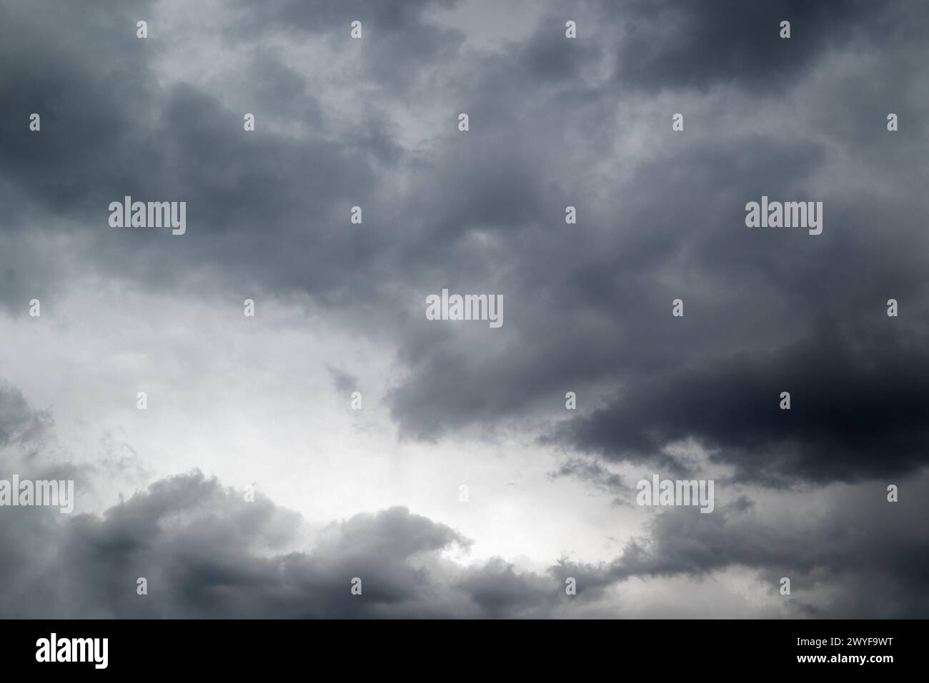 Dark grey storm clouds background. Stock Photo