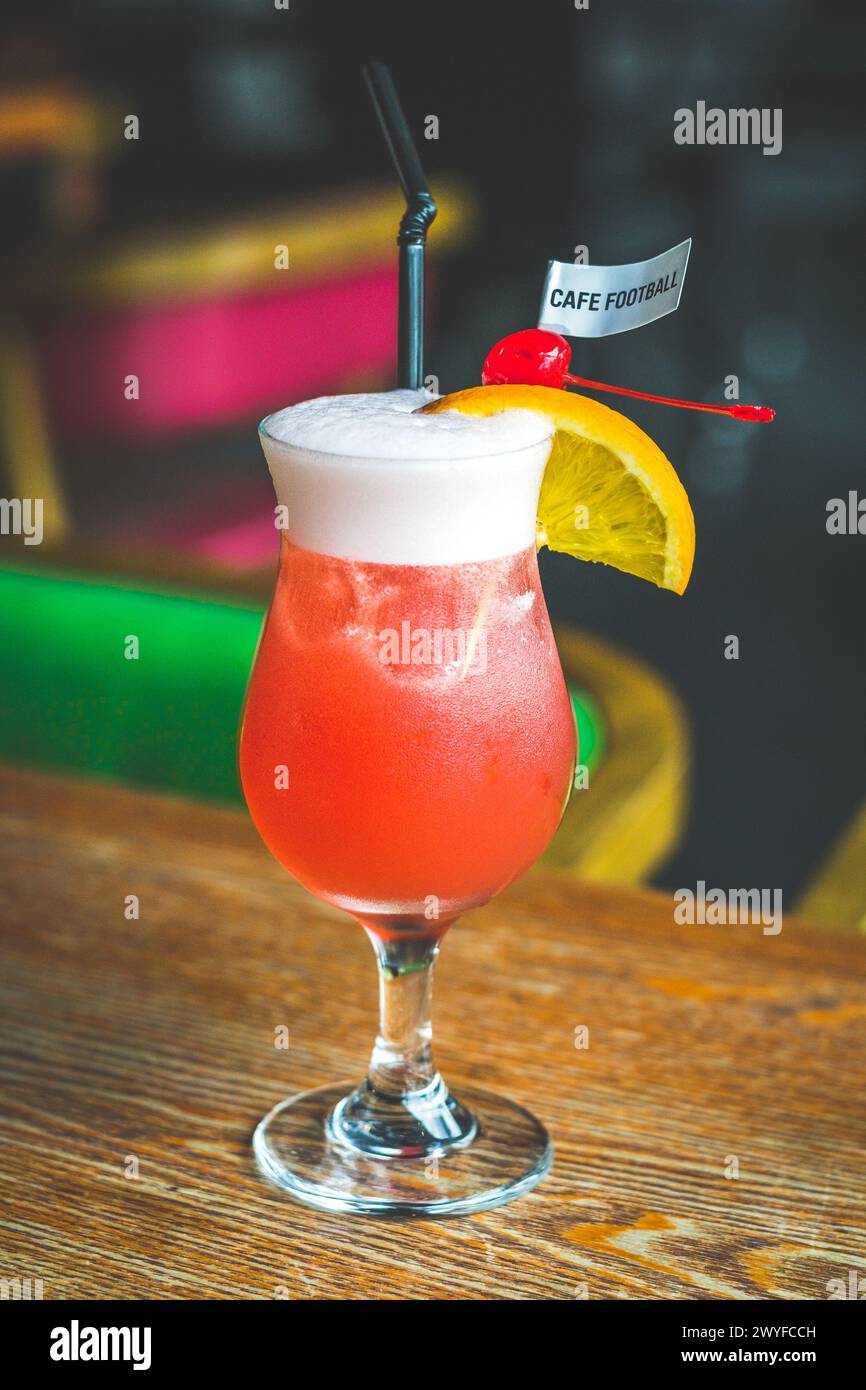 Football Sling made from Cherry brandy, gin, Dom, pineapple juice