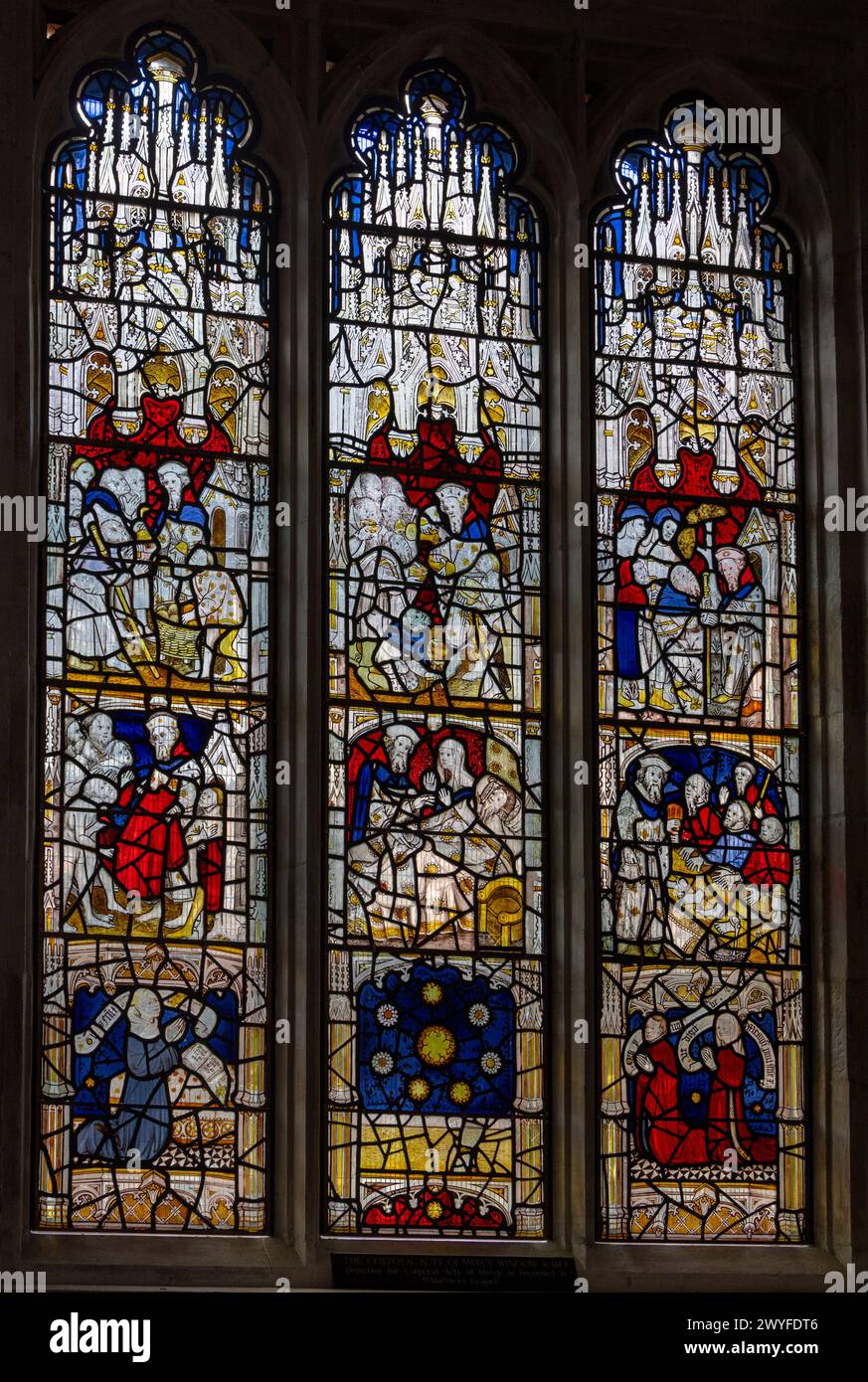 stained glass Corporal Acts of Mercy Window, 1410, All Saints North Street church, York, England Stock Photo