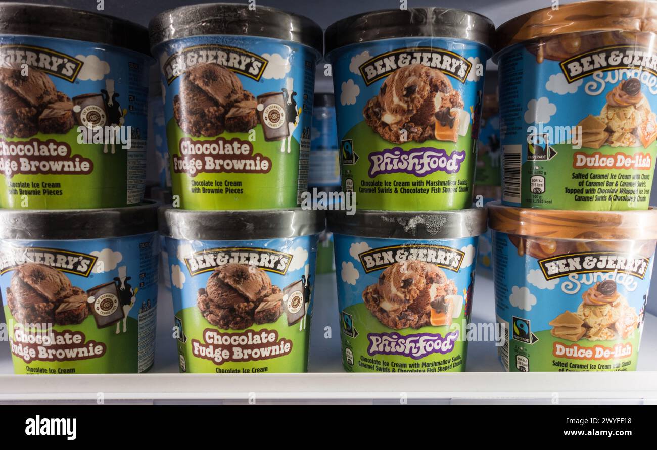 Closeup of Ben & Jerry's Chocolate Fudge Brownie, Phish Food and Dulce De-lish ice cream tubs in a supermarket freezer. Unilever Stock Photo