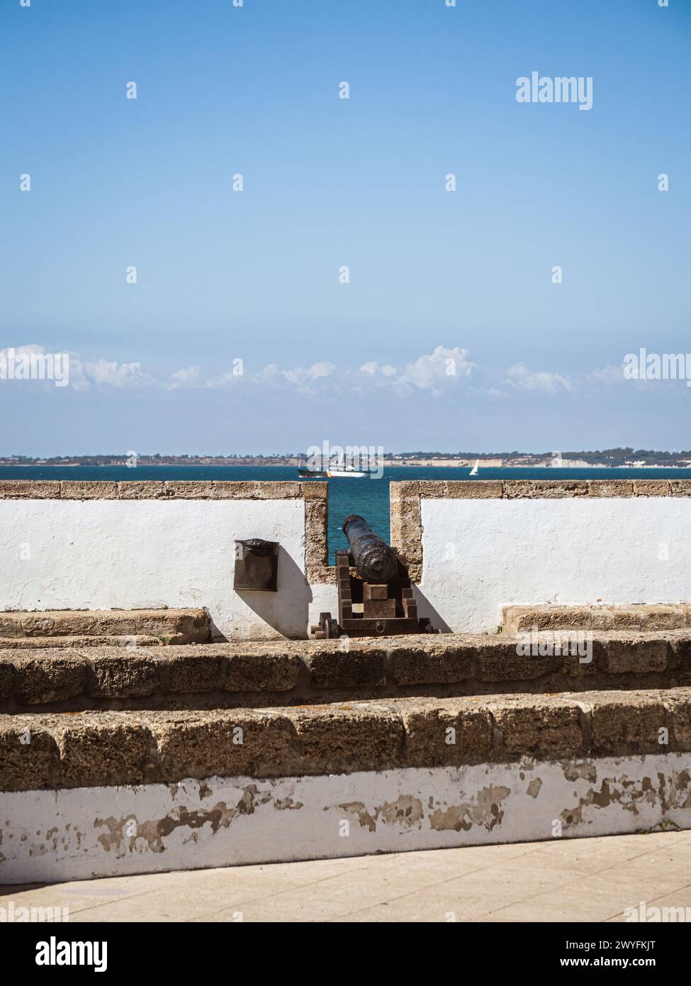 View of the old city wall and battlements with historical cannon in the ...