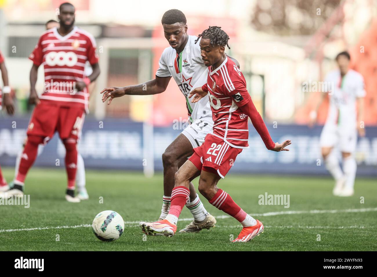 OHL's Ezechiel Banzuzi and Standard's William Balikwisha fight for the