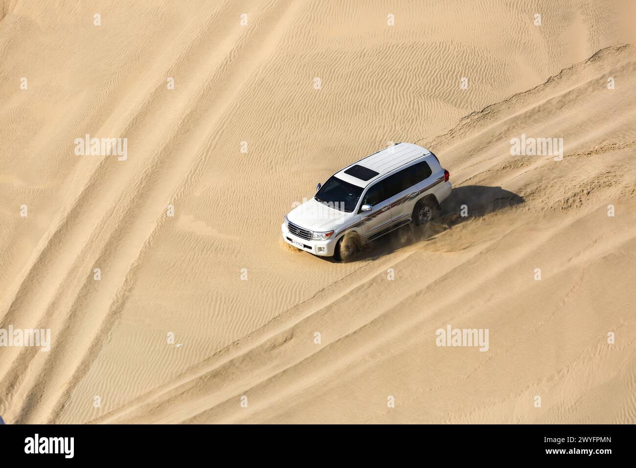 Four wheel drive through the desert in the inland sea, Doha Qatar Stock Photo