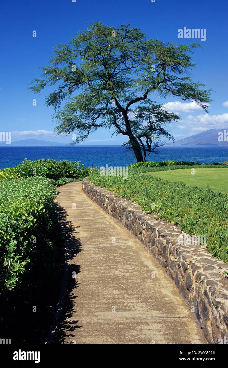 Maui, Hawaii, USA - Wailea Point, south Maui.  Wailea Coastal Walkway.  West Maui in the distance on right. Stock Photo