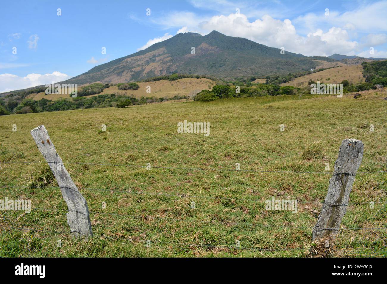 Field and fence at the base of volcano in Costa Rica Stock Photo - Alamy