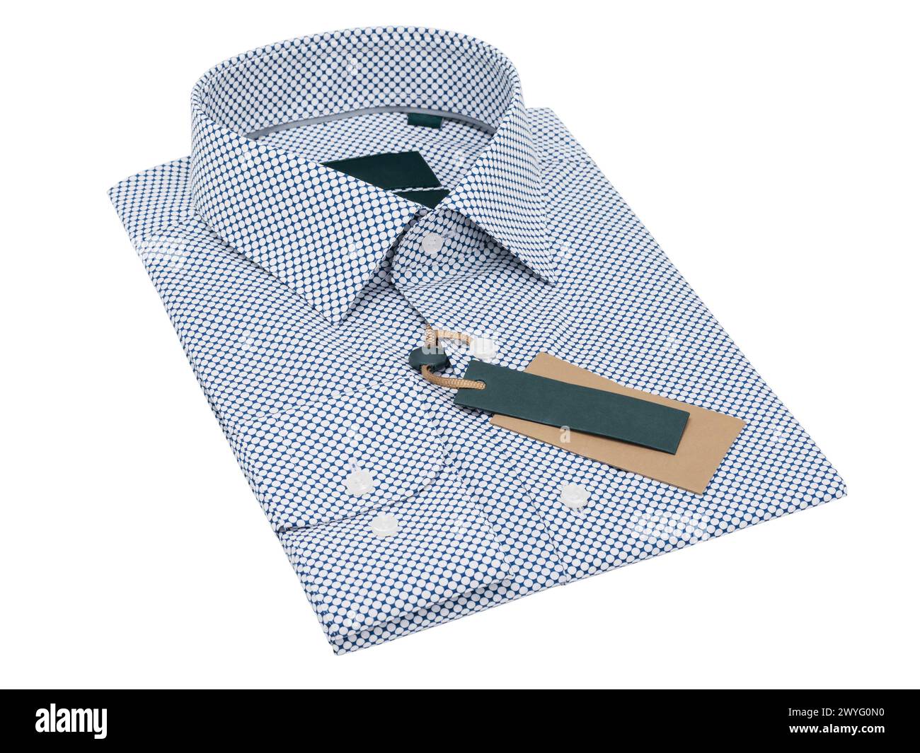 Folded blue white polka dot long sleeve shirt isolated on white background Stock Photo