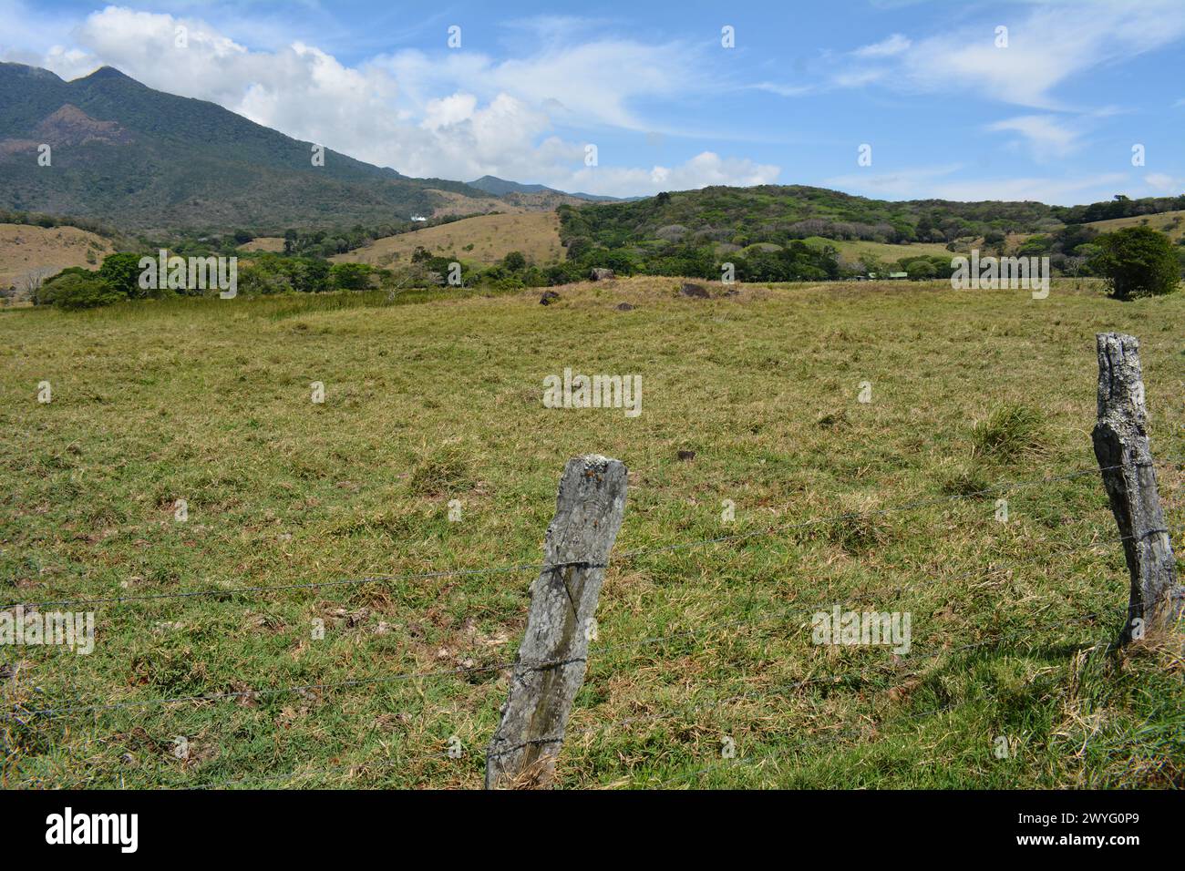 Field and fence at the base of volcano in Costa Rica Stock Photo - Alamy