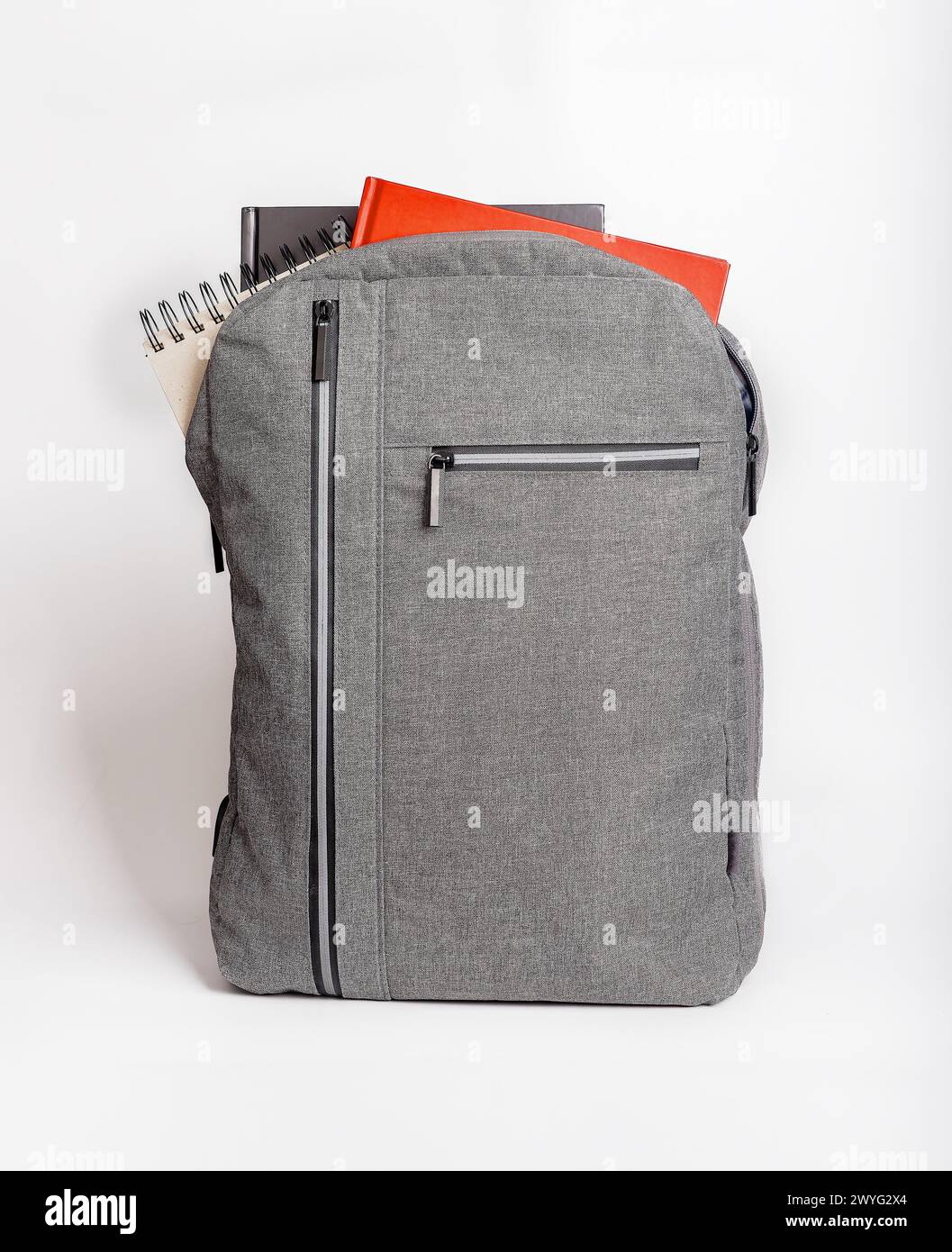 Books, notebooks sticking out from backpack, schoolbag. Stock Photo