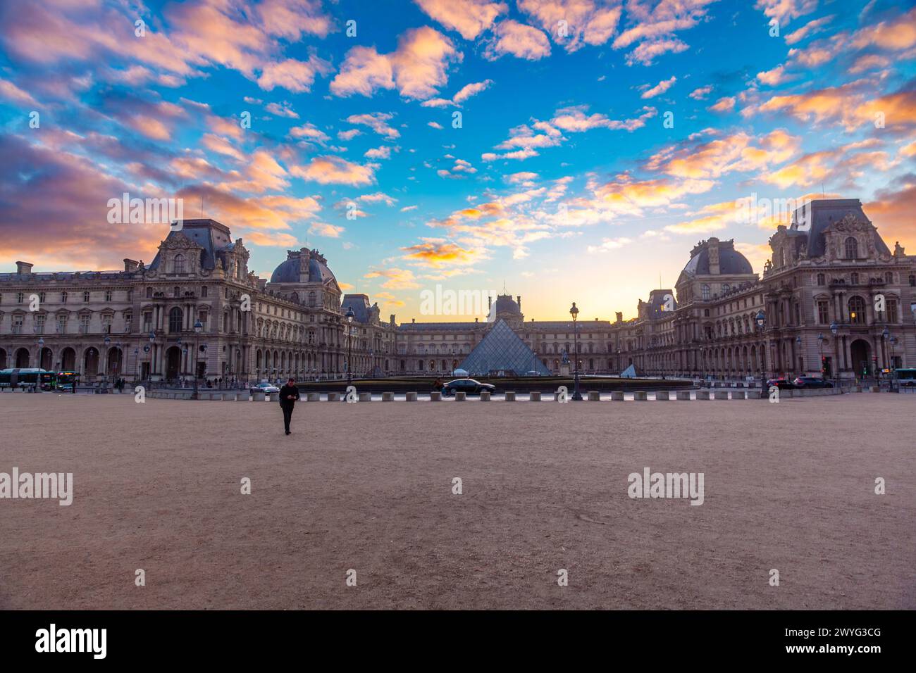 Paris, France - JAN 20, 2022: The glass pyramid of Louvre Museum, the main entrance to famous museum and gallery, completed in 1989. Stock Photo
