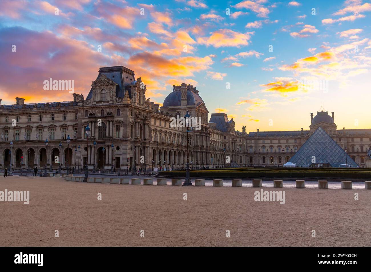 Paris, France - JAN 20, 2022: The glass pyramid of Louvre Museum, the main entrance to famous museum and gallery, completed in 1989. Stock Photo