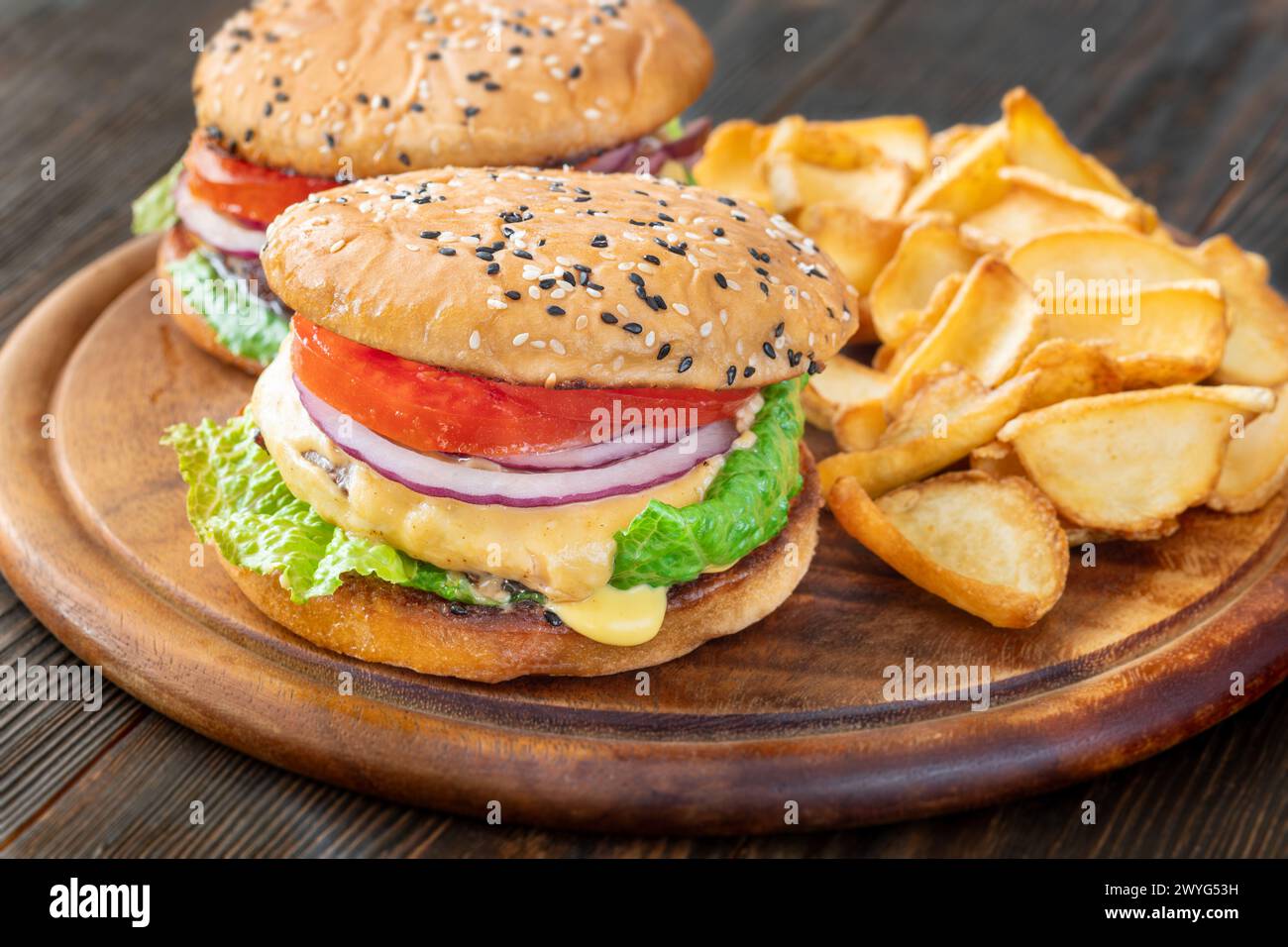 Two homemade hamburgers served with potato dippers Stock Photo