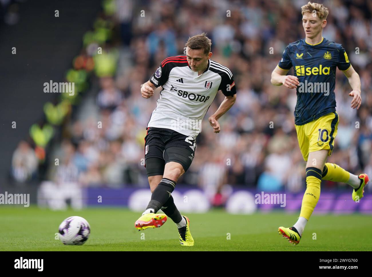 LONDON, ENGLAND - APRIL 6: Timothy Castagne of Fulham under pressure from Anthony Gordon of Newcastle United during the Premier League match between Fulham FC and Newcastle United at Craven Cottage on April 6, 2024 in London, England.(Photo by Dylan Hepworth/MB Media) Stock Photo