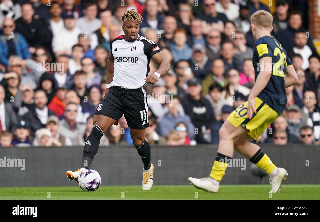 LONDON, ENGLAND - APRIL 6: Adama Traoré of Fulham under pressure from Lewis Hall of Newcastle United during the Premier League match between Fulham FC and Newcastle United at Craven Cottage on April 6, 2024 in London, England.(Photo by Dylan Hepworth/MB Media) Stock Photo