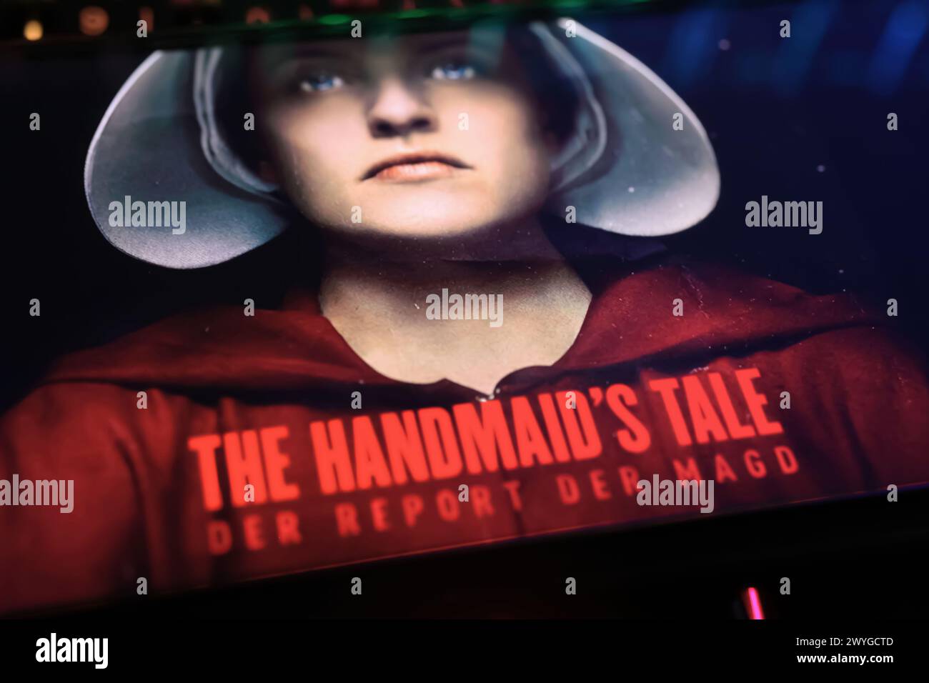 Viersen, Germany - April 3. 2024: MGM television series The Handmaid’s Tale poster on smartphone screen on computer keyboard Stock Photo
