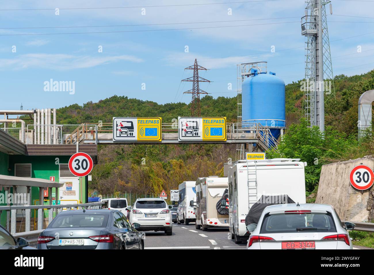 Italy - September 23, 2023: Traffic jam at a toll booth on the highway in Italy with TELEPASS logo on the signs *** Stau an einer Mautstelle auf der Autobahn in Italien mit TELEPASS Logo auf den Hinweisschildern Stock Photo