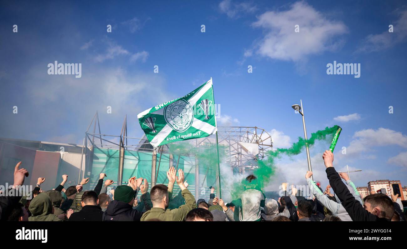 6th April 2024; Celtic Park, Parkhead, Glasgow, Scotland: Celtic fans at Celtic park with flags and smoke devices as the team leaves for the Old Firm game versus Rangers FC to be held on Sunday 7th April Stock Photo