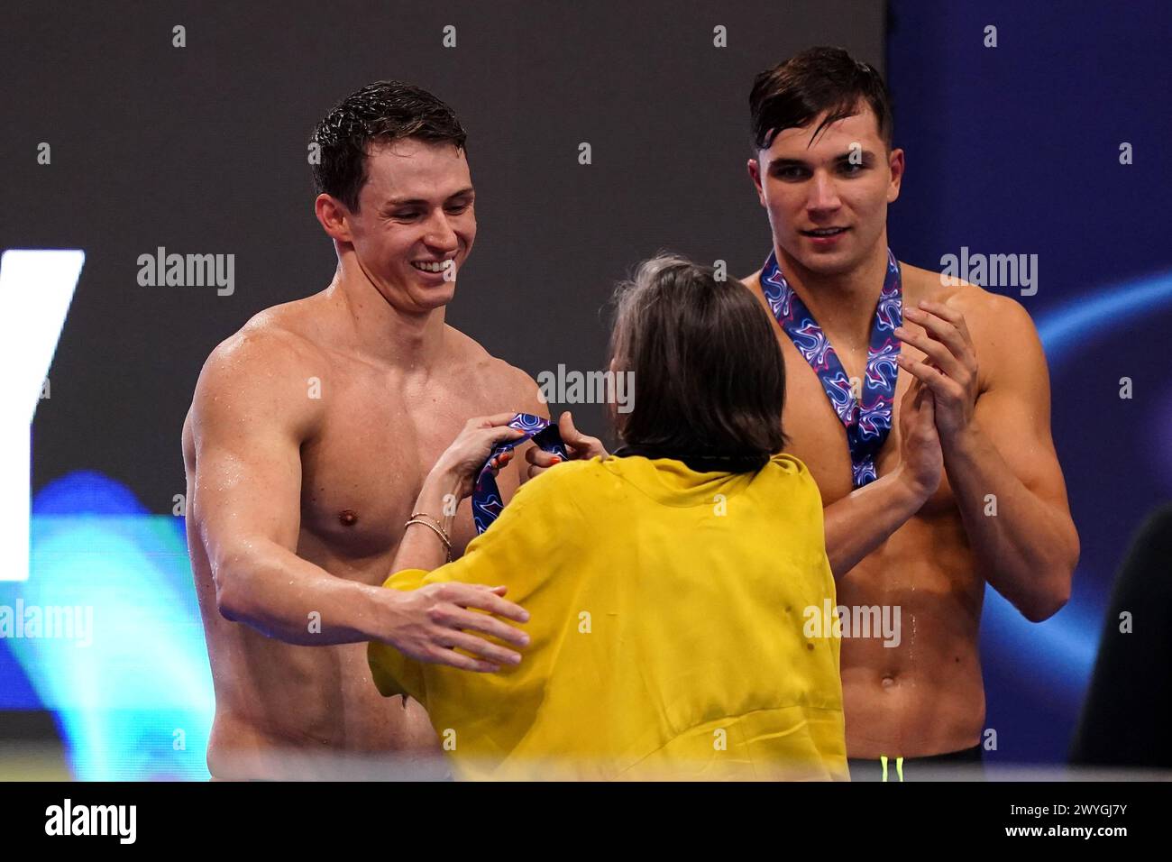 Sam Proud Ben Proud (left) is awarded a gold medal from Sam Proud after winning ...