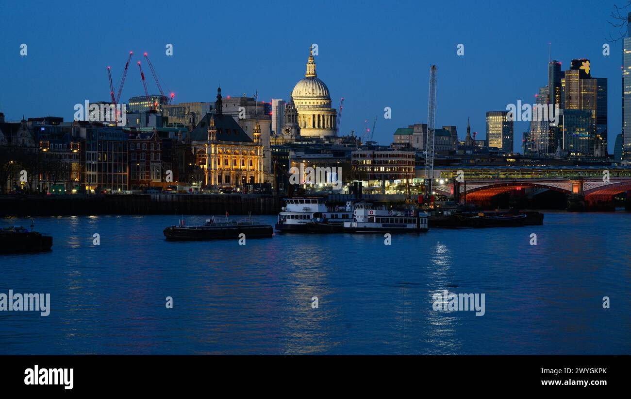 London, UK - March 24, 2024; Cityscape view of the North Bank across the River Thames with St Paul's Cathedral Stock Photo