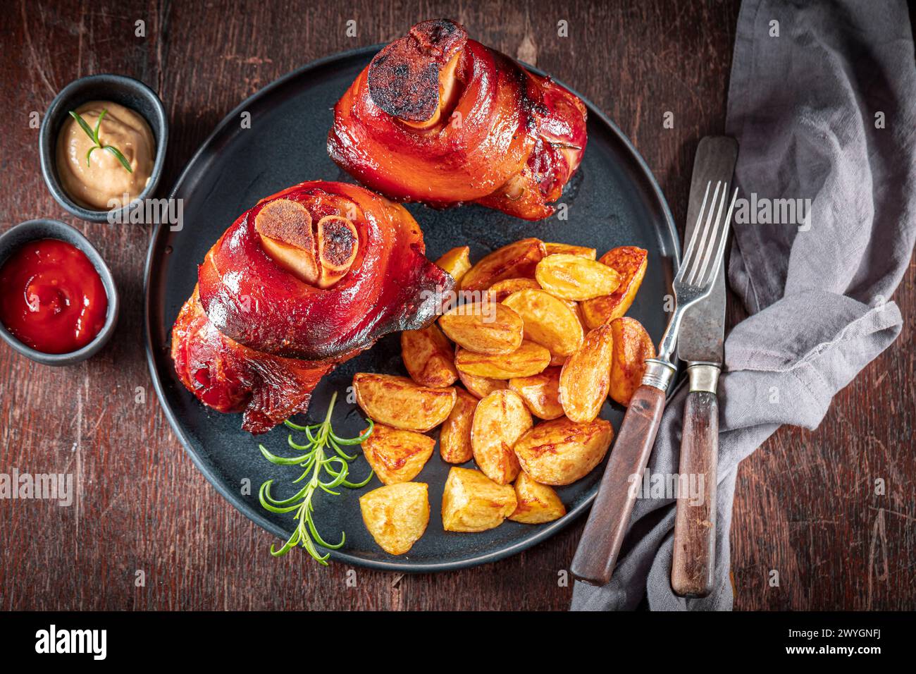 Tasty and grilled roasted Schweinshaxe served with sauerkraut and ... Tasty and grilled roasted Schweinshaxe served with sauerkraut and ...