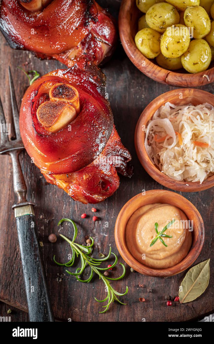 Aromatic and fat roasted pork knuckle served with sauerkraut and ... Aromatic and fat roasted pork knuckle served with sauerkraut and ...