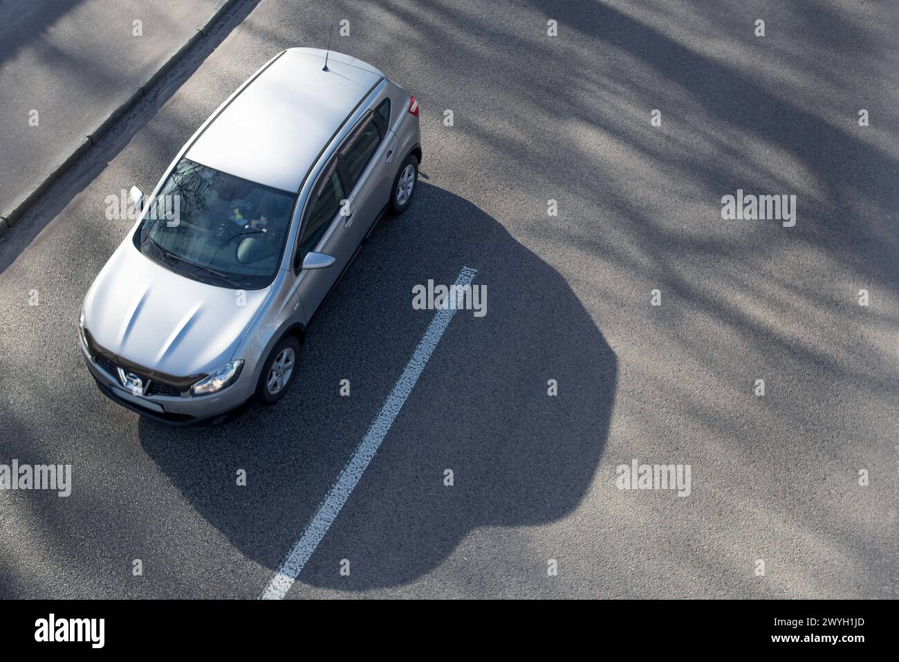 top view of the car driving along an empty road, top view, new grey car Stock Photo